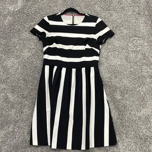 Black and white striped dress with gold zip on the back